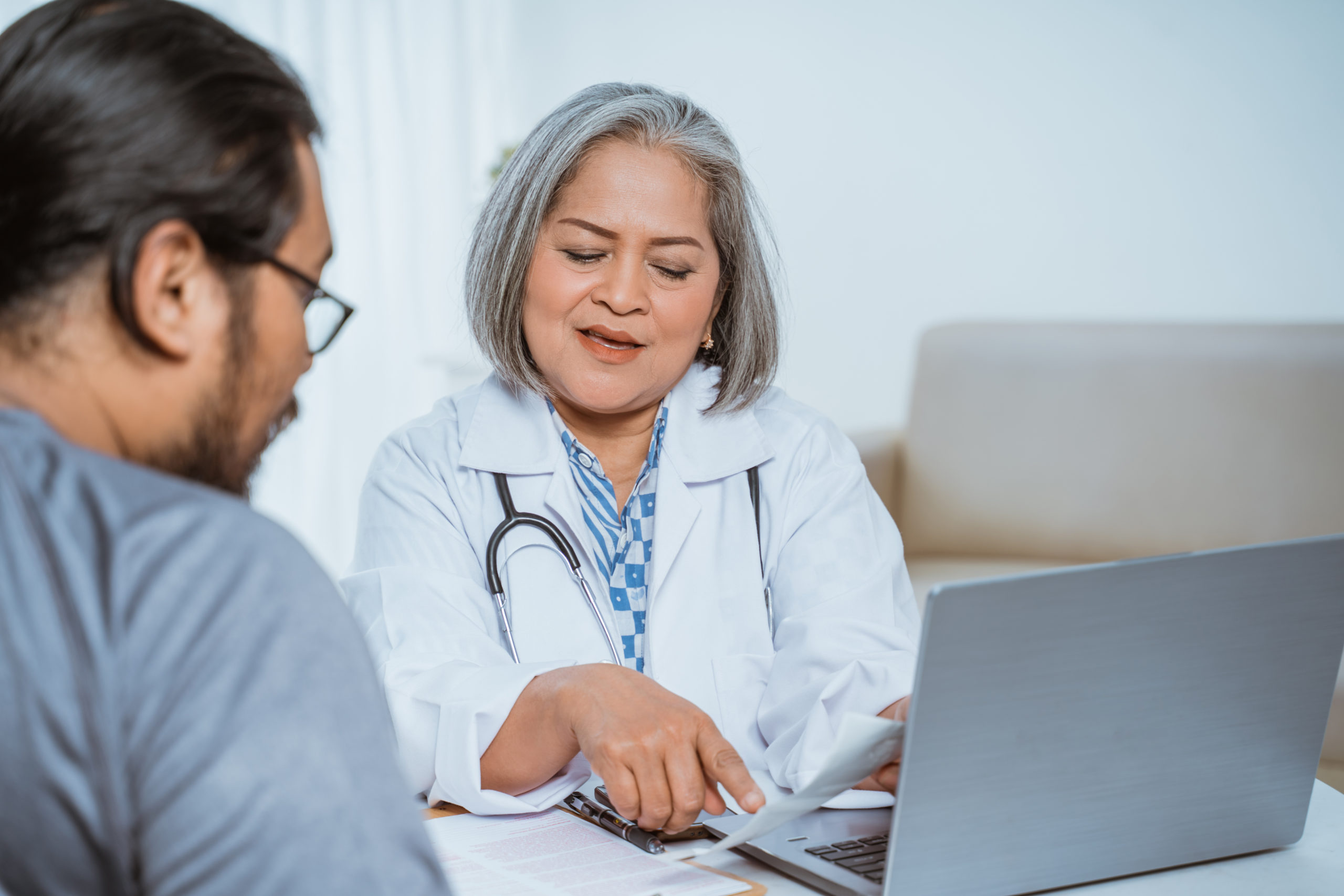 Doctor reviewing form with patient