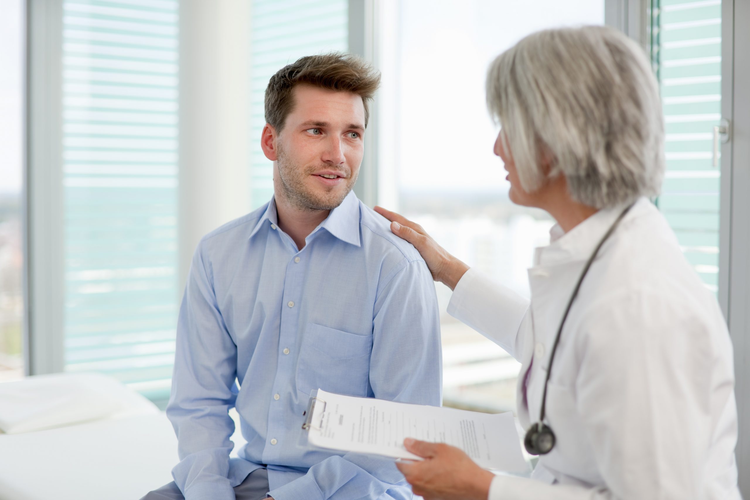 Doctor reviewing form with patient