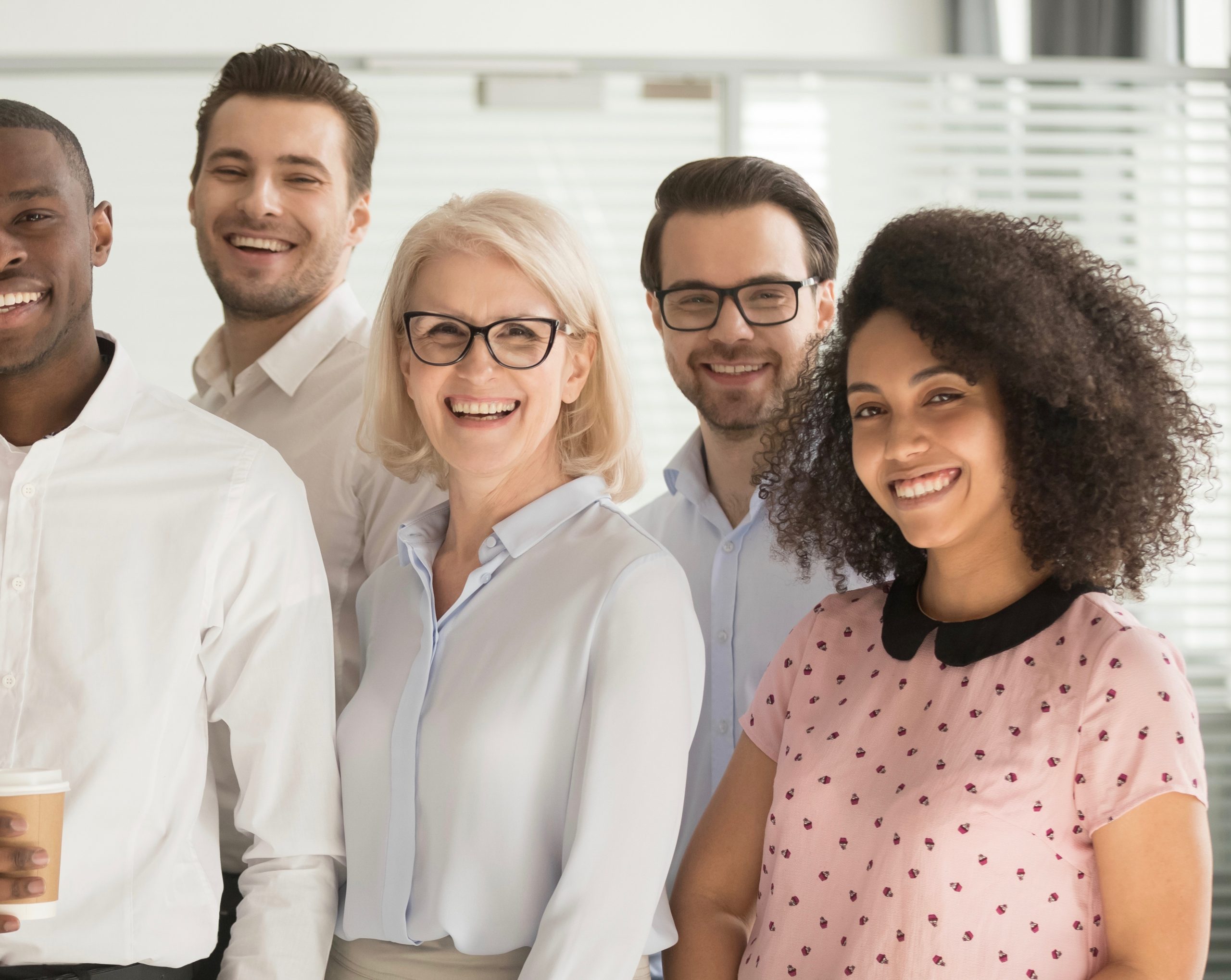  Motivated international multi-ethnic company members aged and young corporate team photographing posing for camera, successful staff portrait concept of growth in career leadership and racial equality 
 