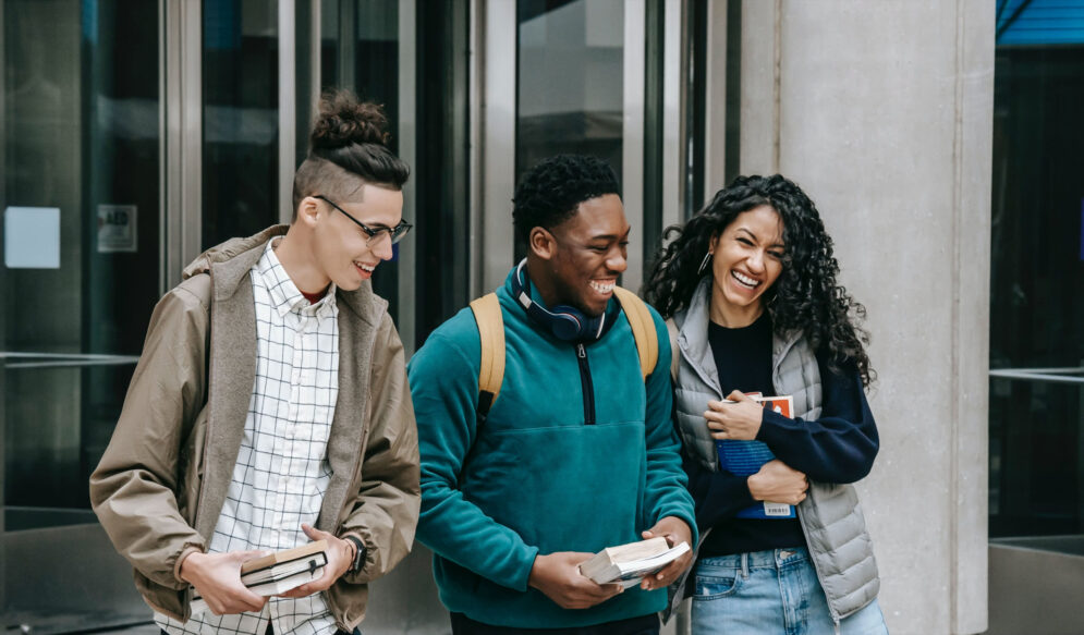 Diverse group of young students walking together